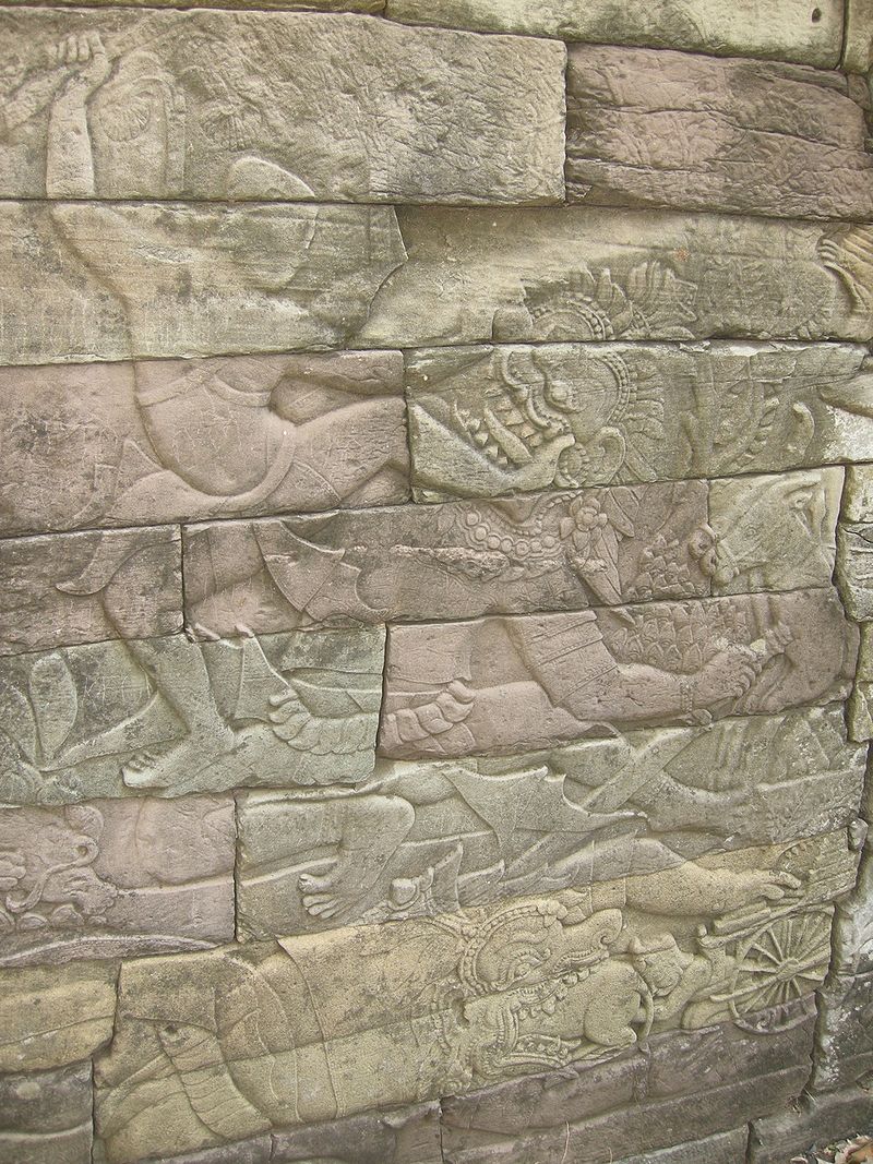 A kick delivered to a downed or falling enemy (a demon), Angkor period (ca. 13th century) bas-relief at Banteay Chhmar.